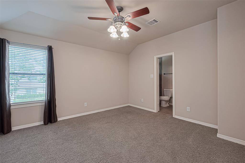 The last bedroom on the 2nd floor has carpet, en-suite bathroom, ceiling fan with light kit and 2" faux blinds.