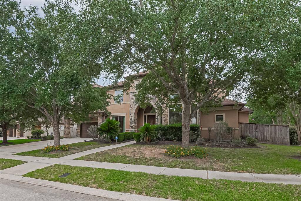 Exterior of the home has seamless gutters, accent coach lights, Stacked stone,10x3 covered entry and extended covered parking area. What a beautiful Partners In Building home.