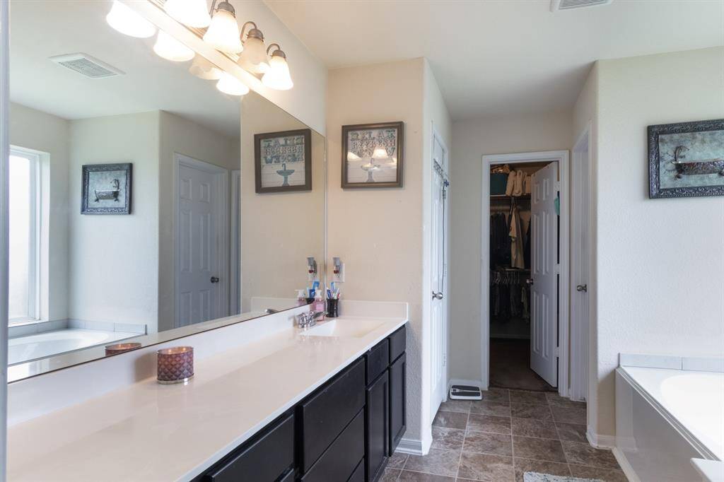 The primary bath has a tub & separate shower.