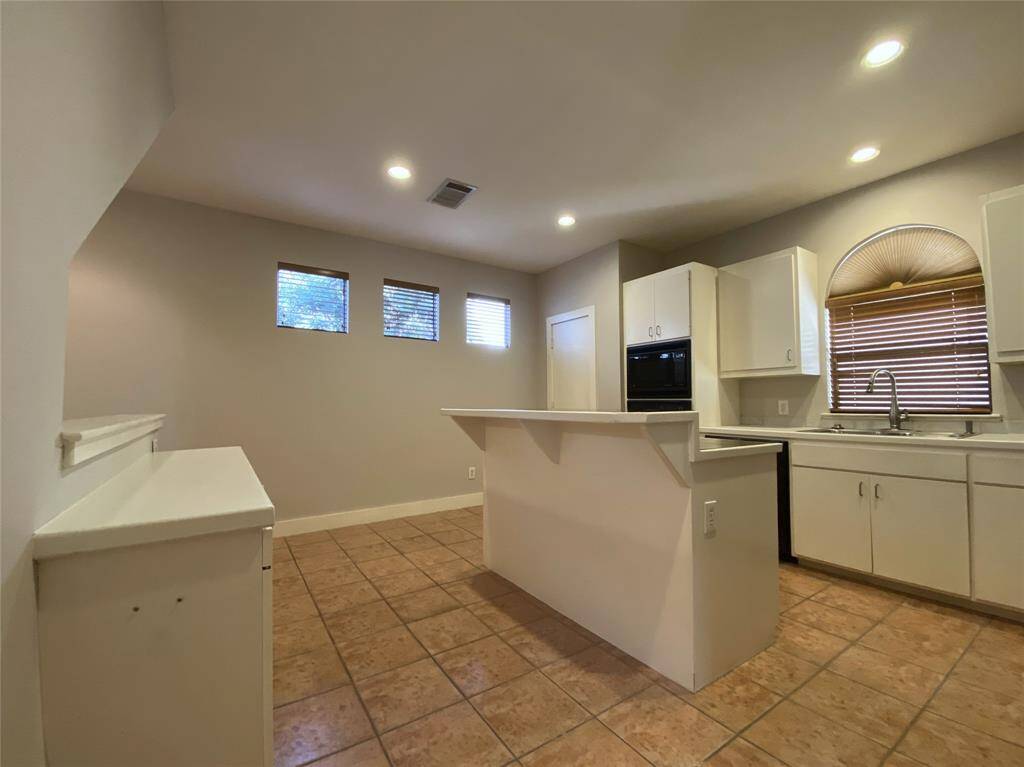 Alternate view of the kitchen. Notice the built-in buffet counter on the left.