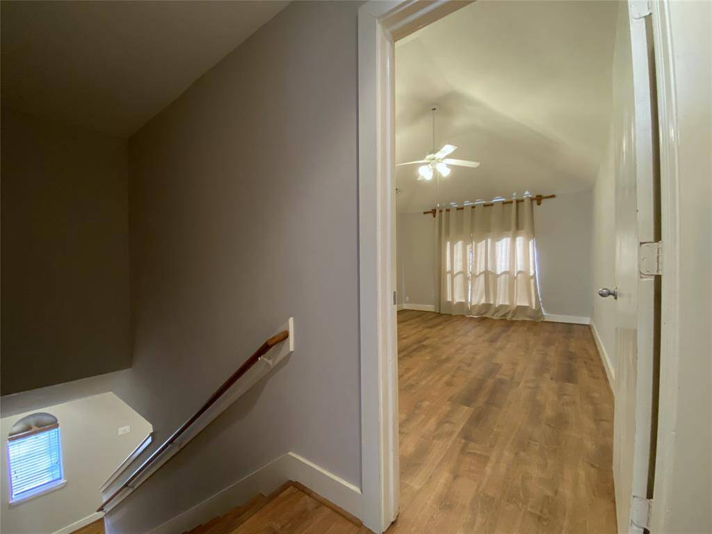Immediately at the top of the stairs is the primary suite.