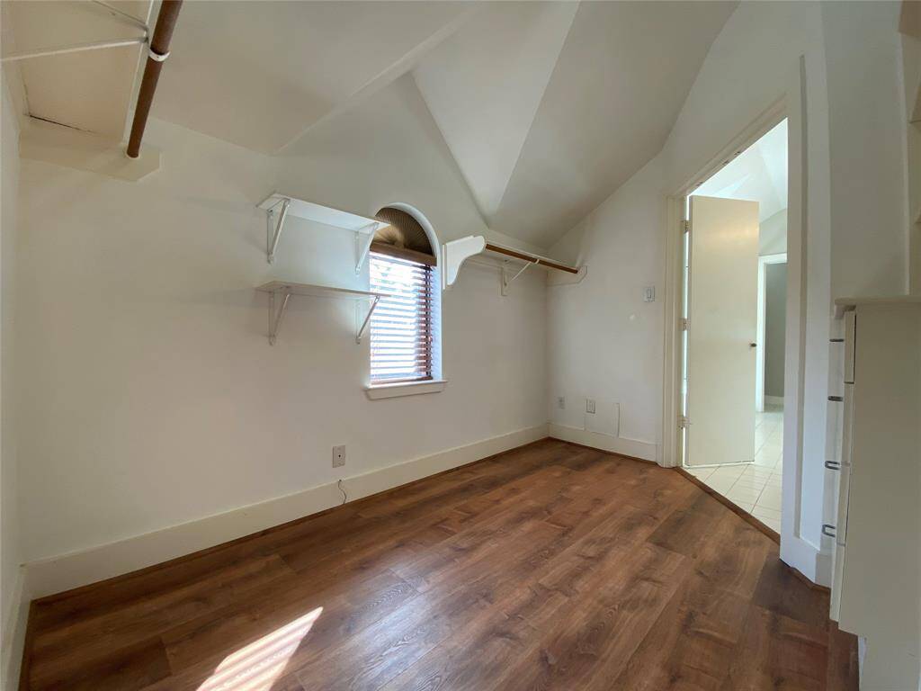 A window brings natural light into the closet.