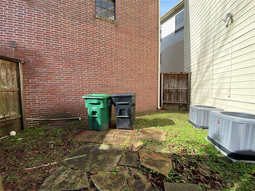 With privacy fencing, the side yard can be utilized for a place to store the trash bins or a place to entertain.