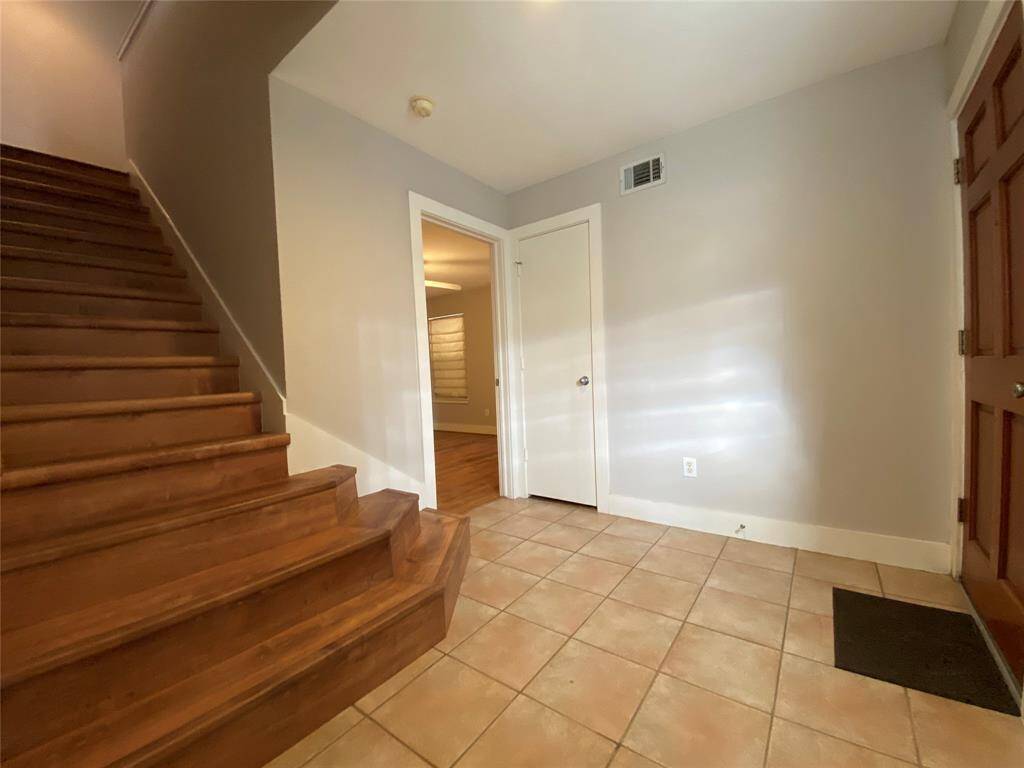 The flooring on the stairway to the 2nd story is vinyl plank.