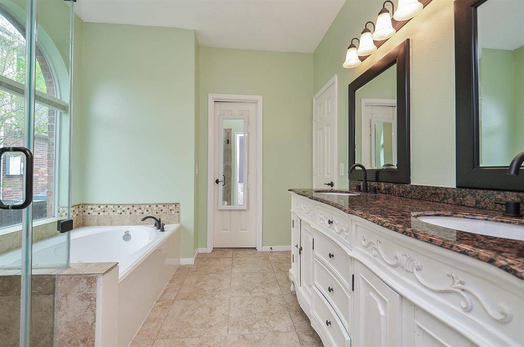 Soaking tub for relaxation. Updated mirrors. Beautiful tile accents.