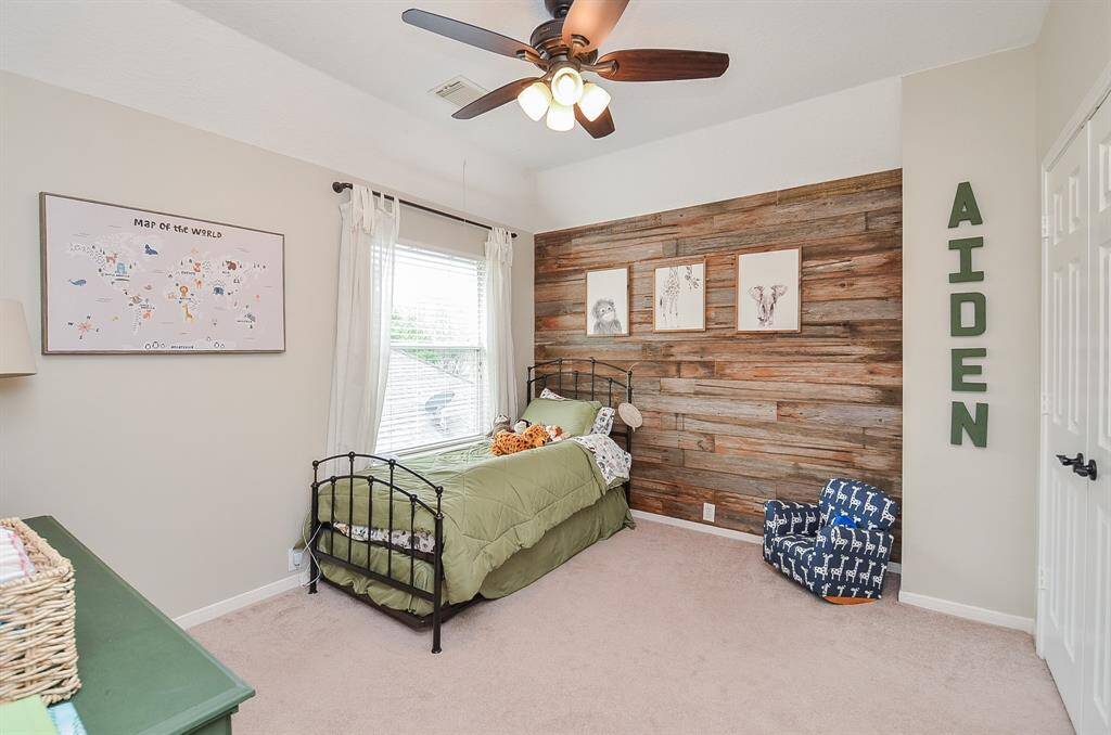 Bedroom 2 is large with wood accent wall and good sized closet.