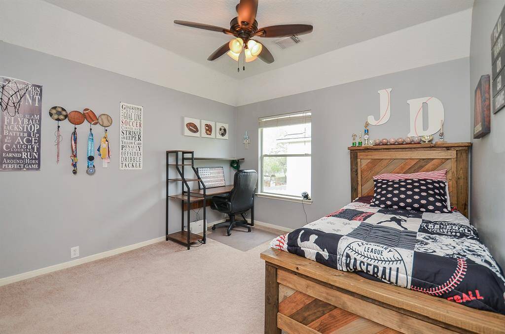 Bedroom 4 with soft grey painted walls.