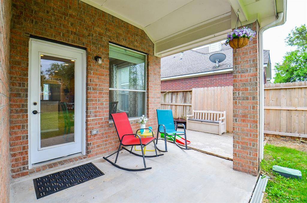 This large covered patio has additional patio space making this perfect for grilling, entertaining or playing games.