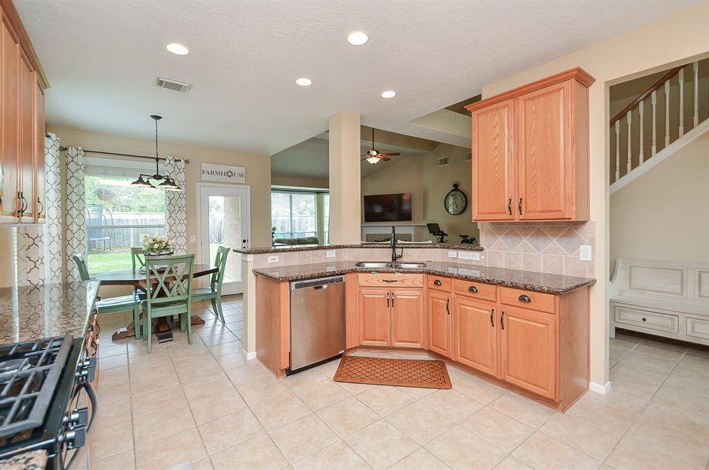 Open to living room and breakfast room.  While MOMMY is lounging on the couch and DADDY is cooking dinner ... everyone can still be together.  :)  Recessed lighting and updated hardware.