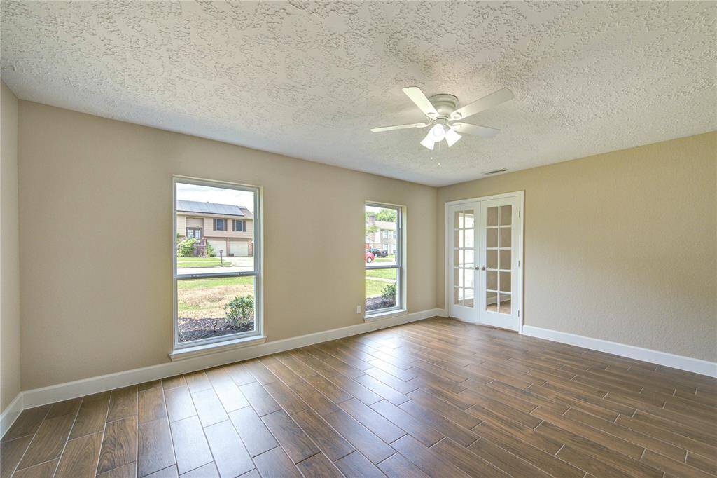 This flex space is to the right of the entryway and provides an excellent spot for an office, or anything that fits your style. Note - all windows and doors through the house have been replaced.