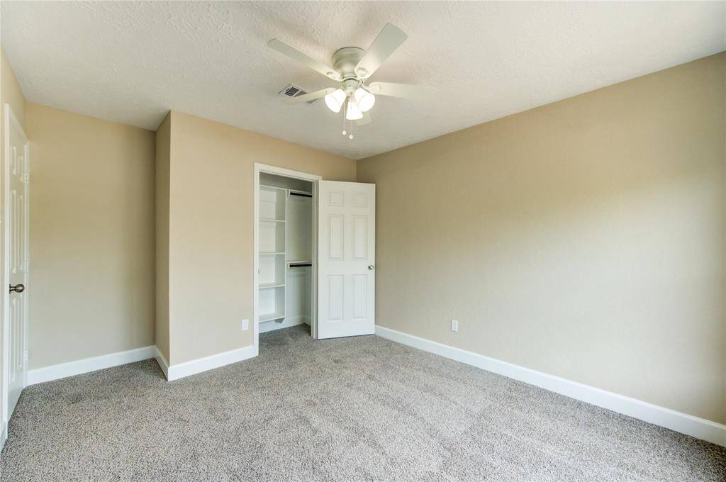 Bedroom #2 Features custom built closets.