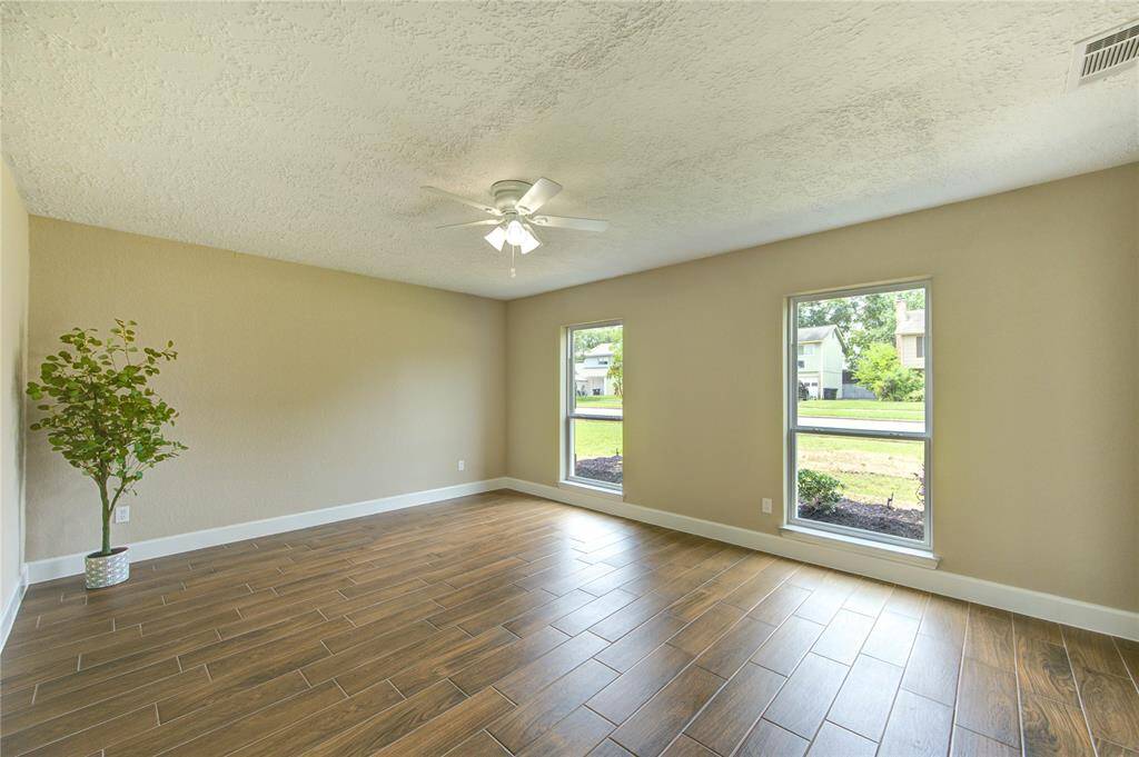 Notice the bright and airy room that features large new windows for natural light creating a welcoming and versatile space.