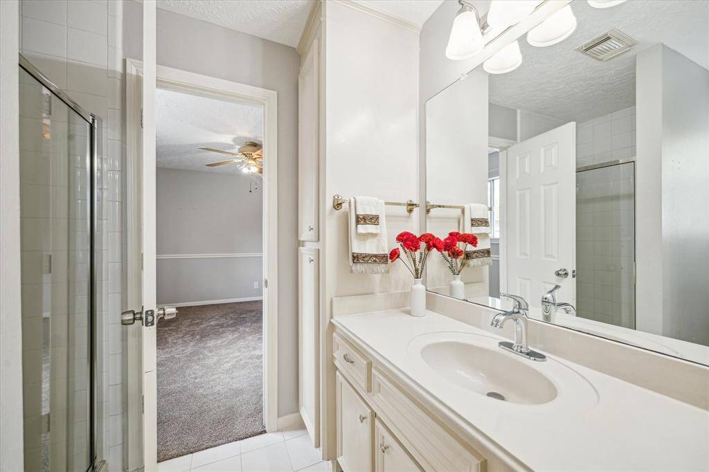 Well-appointed secondary bathroom, conveniently shared between two bedrooms.