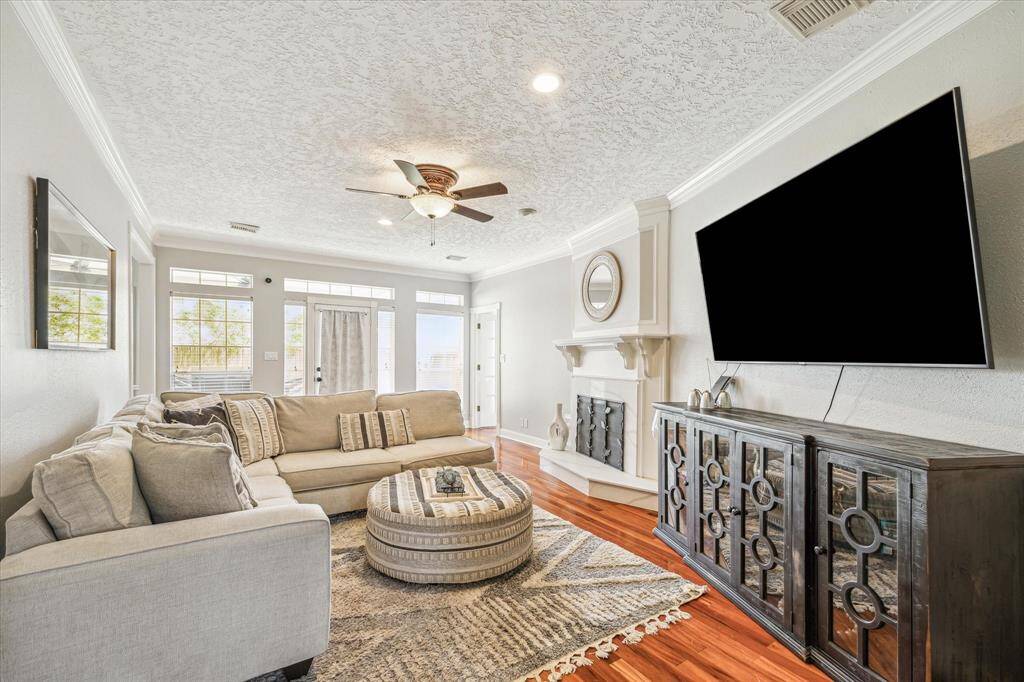 Bright family room with direct access to the large backyard—ideal for indoor-outdoor living.fireplace, perfect for relaxing or entertaining.