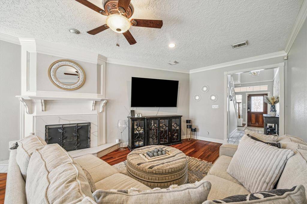 Spacious family room featuring a cozy fireplace, perfect for relaxing or entertaining.