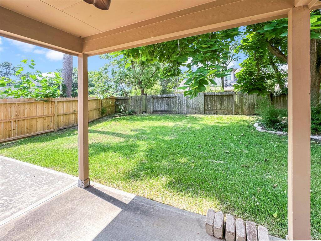 Covered patio to relax and enjoy the peaceful backyard