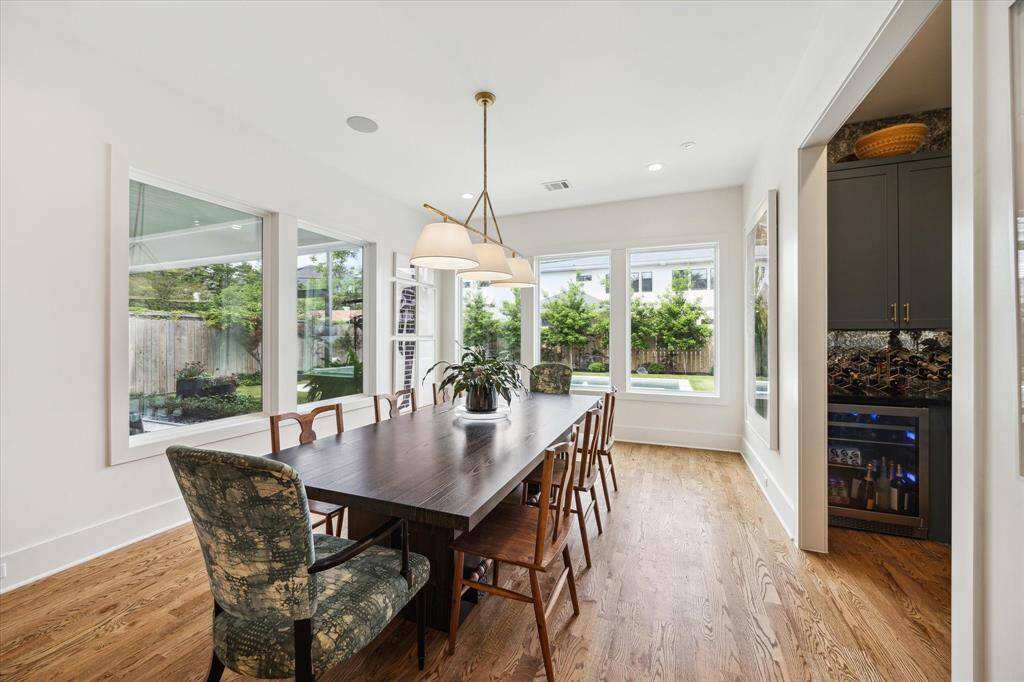 The dining room sits at the end of the kitchen allowing for a peaceful view of the pool.