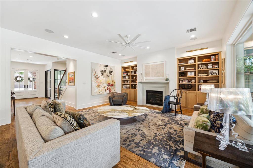 Relax in the living area with exquisite French Oak built-ins and a cozy fireplace.
