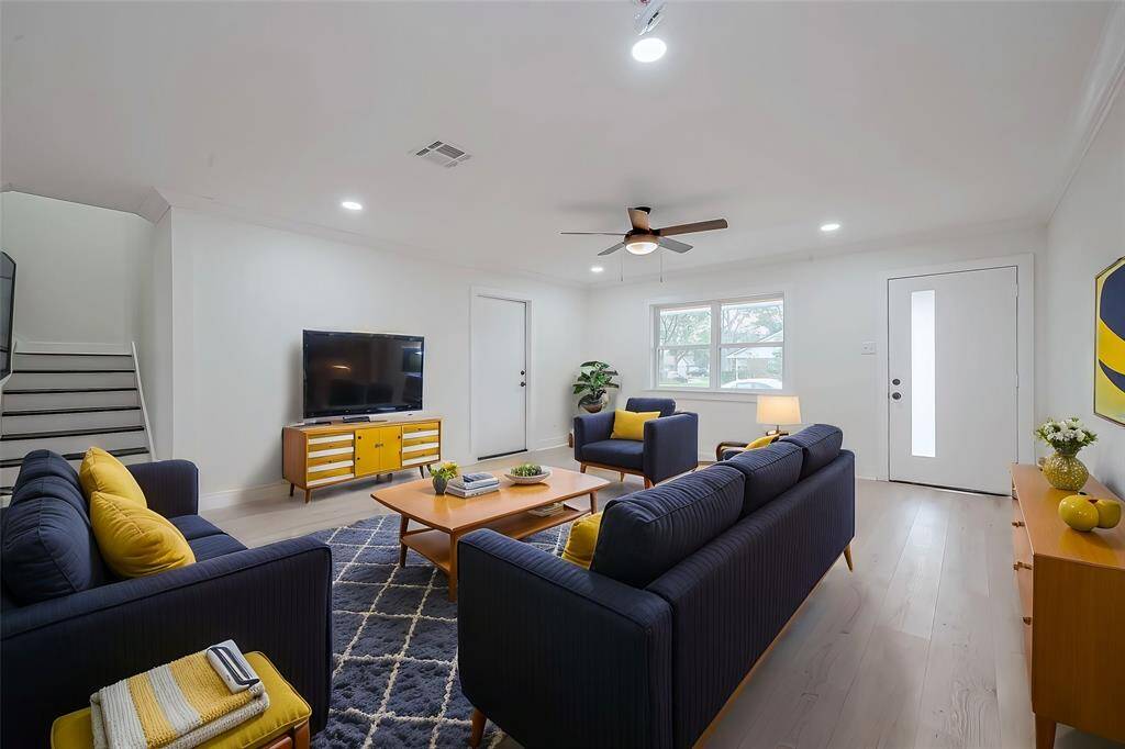 Bright and open living area has meticulously kept vinyl plank flooring and a bright and airy space that will be perfect for you and your family.