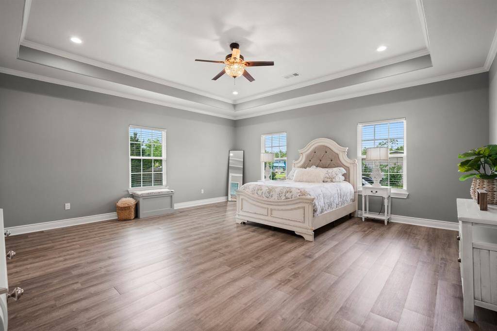 Oversized primary bedroom offers a true retreat. This peaceful haven is designed for ultimate comfort.