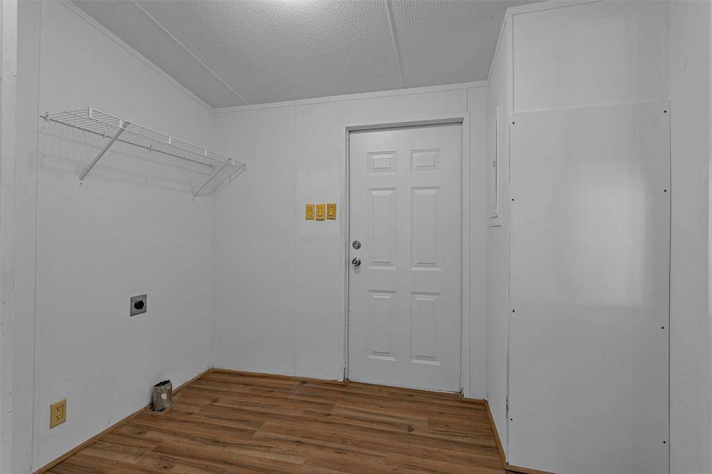 Door to the back yard is off the utility room
