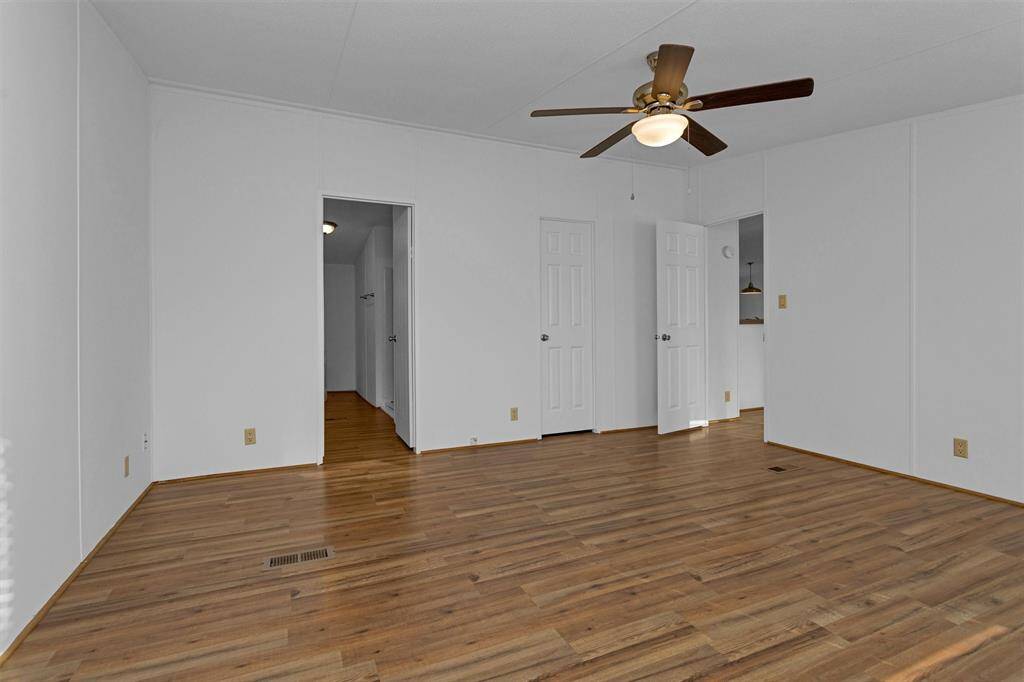 Primary bedroom with ensuite bathroom and walk-in closet