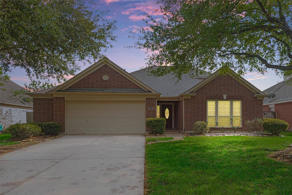 Welcome to 16715 Red Circle Falls! This charming brick home with a two-car garage and a spacious driveway. The front yard features mature trees and well-maintained landscaping, creating an inviting curb appeal.