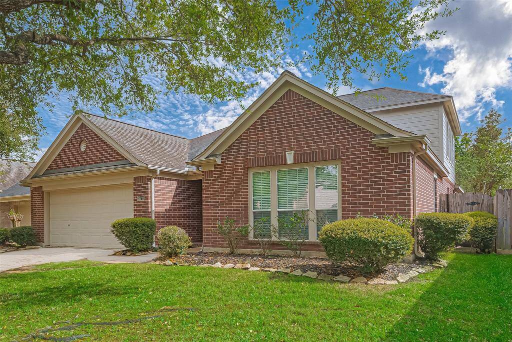 Gorgeous curb appeal with lots of shade provided by the mature trees which is essential in the Texas heat.