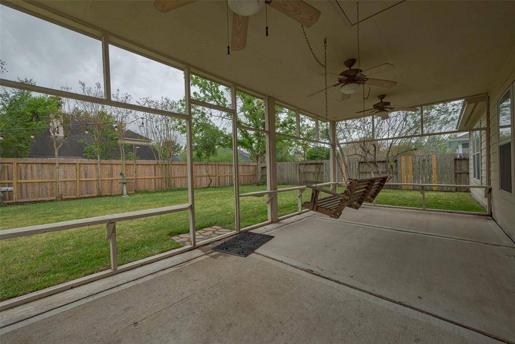 Very spacious yard is a great place for kids and pets to roam free and play as you relax on the covered patio space.