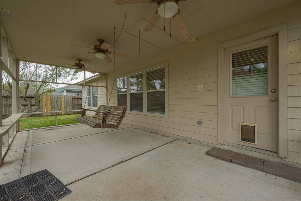 The back yard is a great place for pets and kids to have their own space to play. Add a table and chairs to the brick patio for an al-fresco meal.