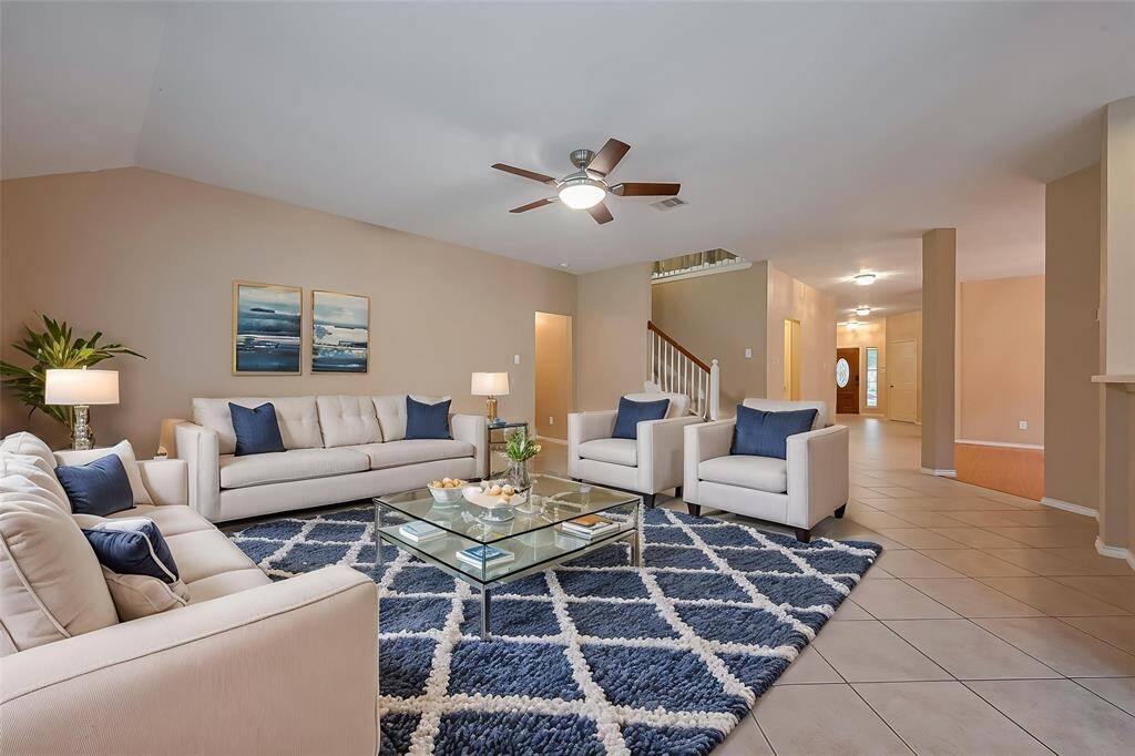 Bright and open living area has brand new wooden floors, stunning gas fireplace, and a bright and airy space that will be perfect for you and your family.