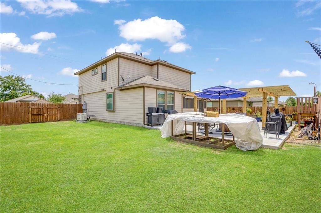 Spacious backyard with a view of the whole-home Generac generator