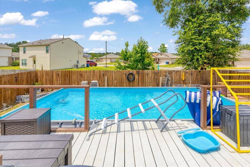 WOW!!! Cool off in style! This beautifully maintained above-ground pool with an elevated deck is perfect for summer fun!