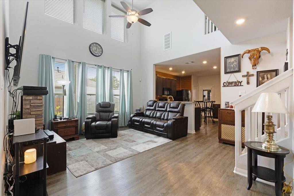 This open and airy living space features tall ceilings and a seamless flow