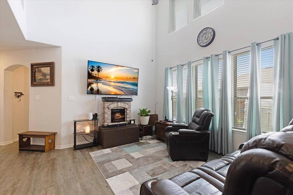 Flooded with natural light from large windows, the living area offers a bright and inviting atmosphere