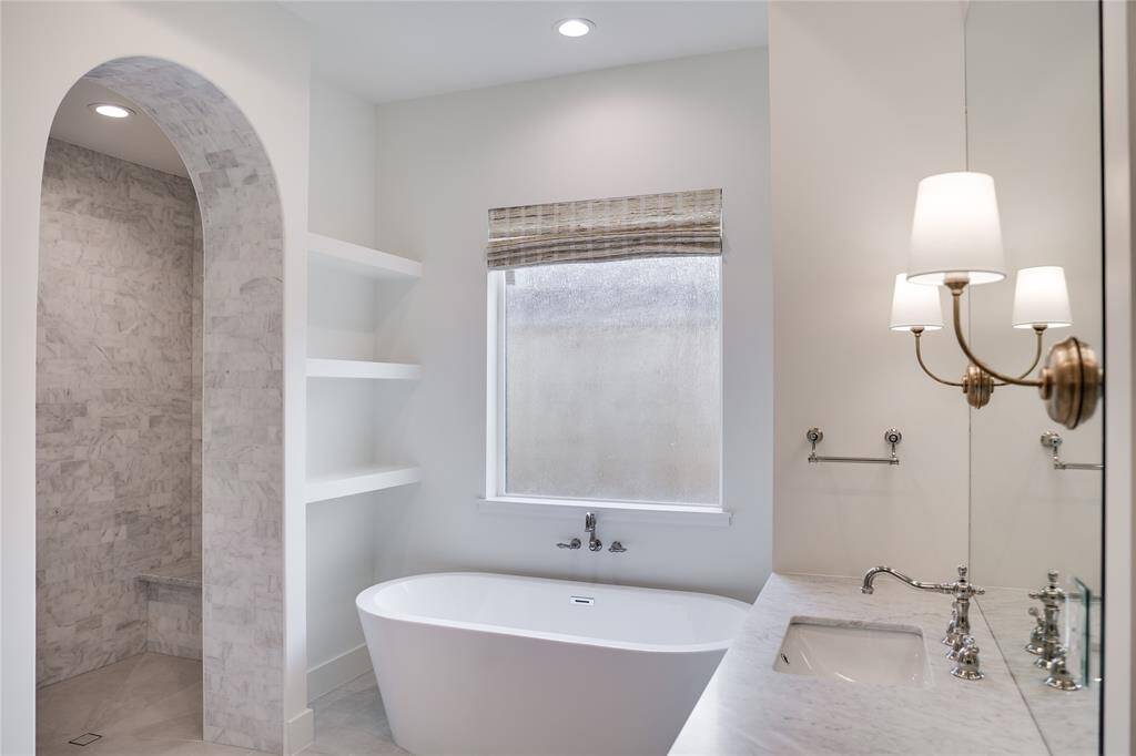 Previously Completed work with similar design and featuring this stunning arched shower entrance.