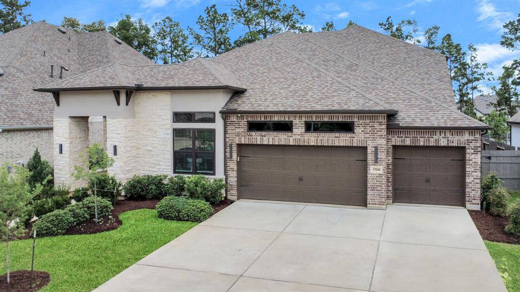 3 car garage with a built-in EV charger for your electric car