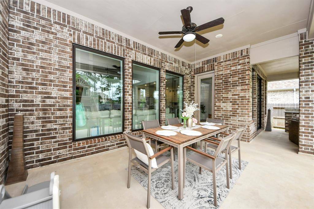 Extended covered patio with two sitting areas