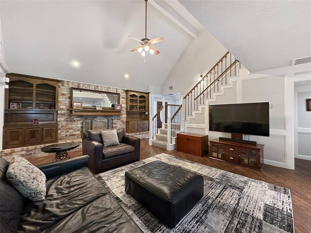 The charming living room serves as the perfect introduction to the home’s welcoming layout.