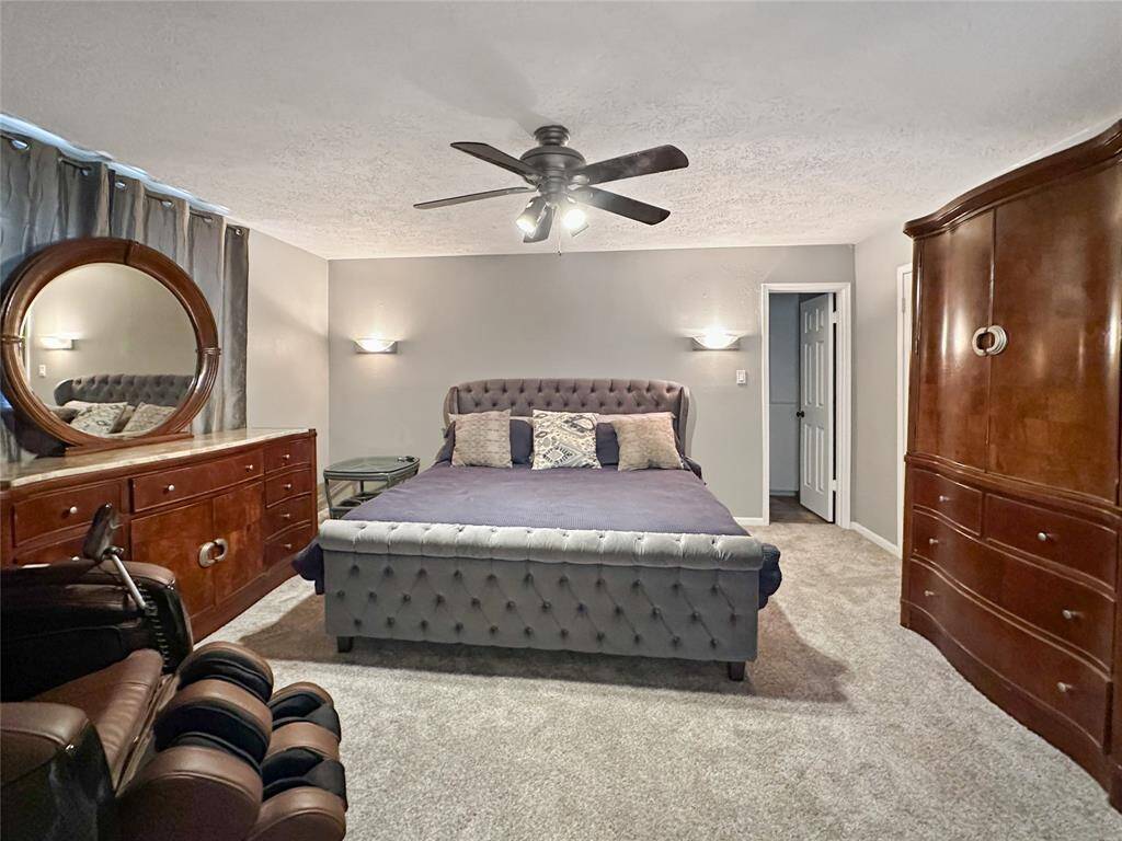 Primary bedroom is located downstairs and offers three (3) closets!