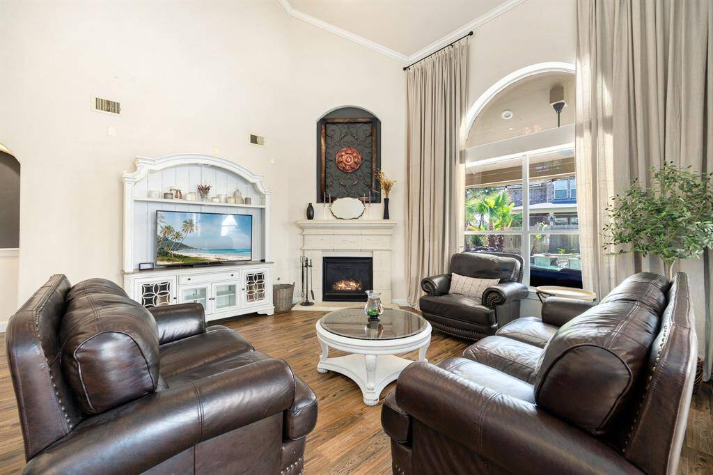 The elegant arched windows flood the space with natural light, all while offering beautiful views of the pool.
