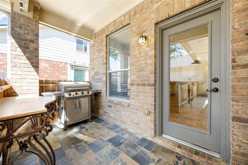 This cozy patio features a stylish slate floor.