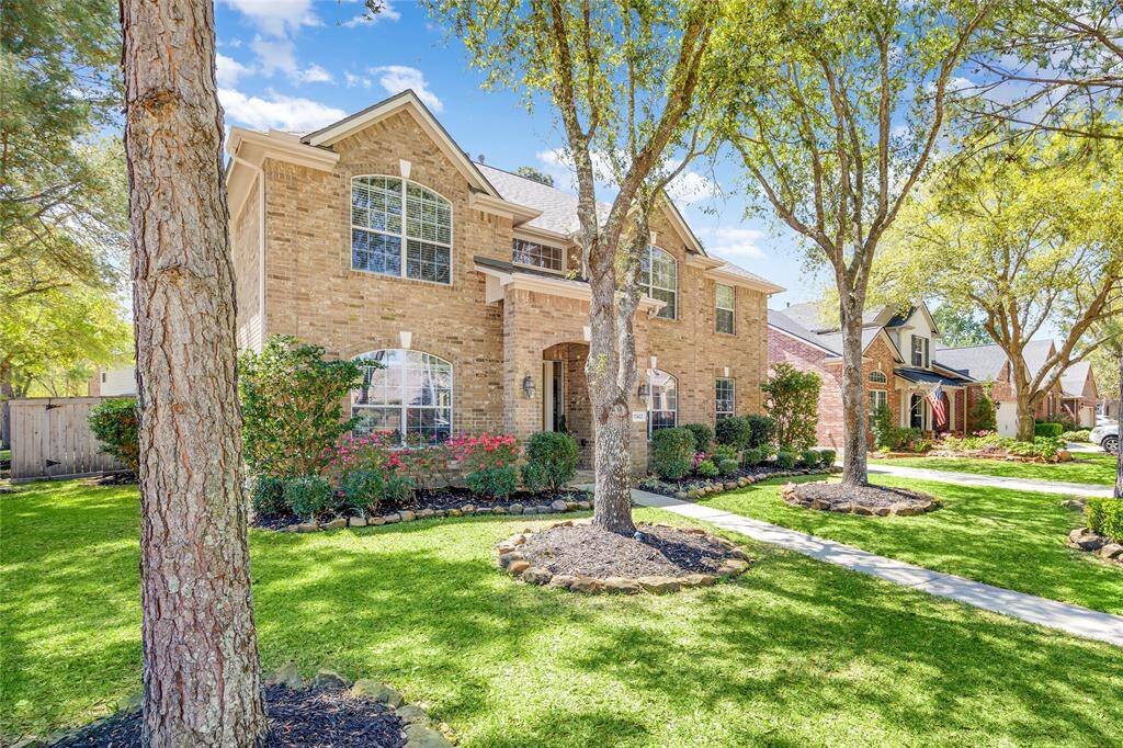 This stunning two-story home is situated on a desirable corner lot, offering both privacy and plenty of space.