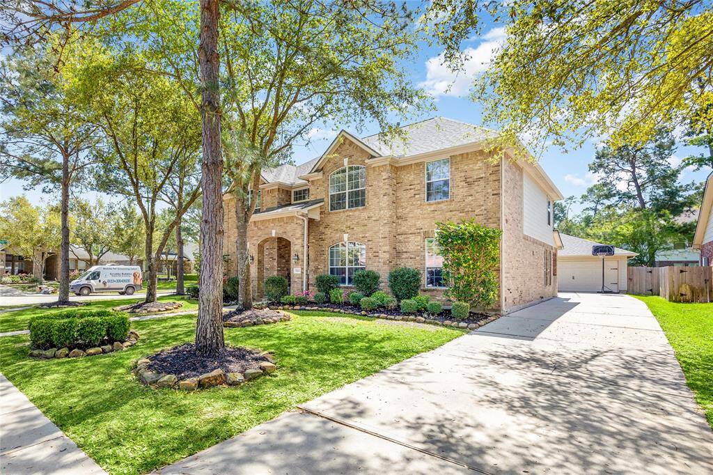 This home features a detached garage and an extended driveway.