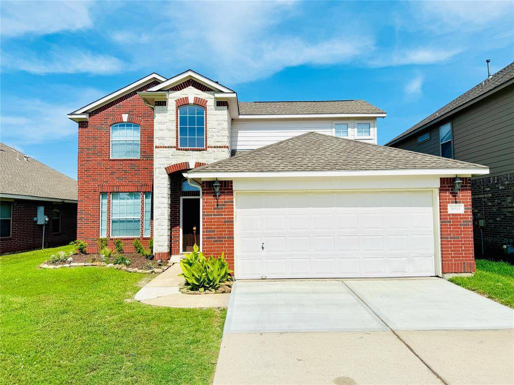 Front of the house with well maintained landscape