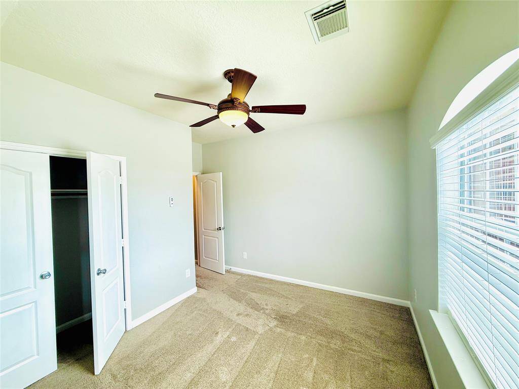 Second bedroom with an en-suite bathroom and two closet spaces