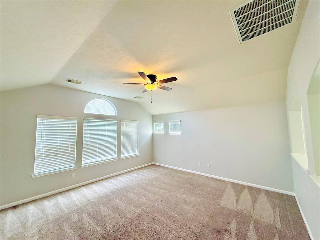 Fourth bedroom remote controlled fan and a walk-in closet