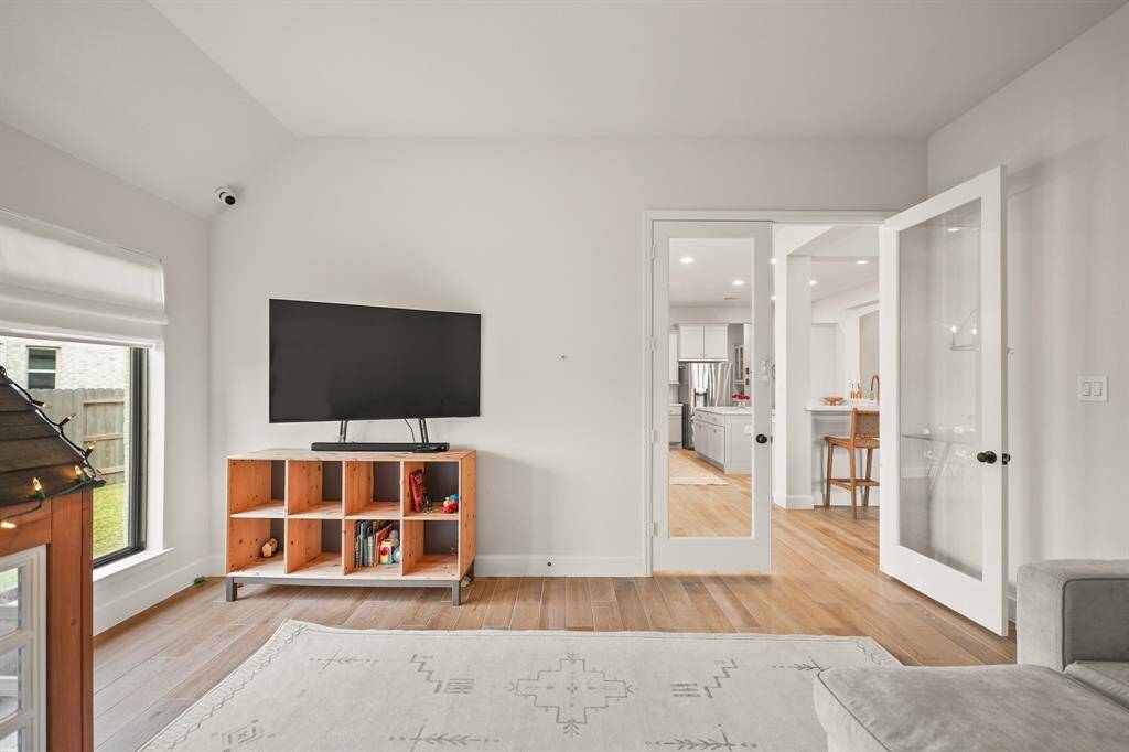 This Game Room is conveniently located near the Kitchen & Breakfast Room, enclosed with French Doors, making it perfect for quiet movie nights, game day gatherings, or even a second office.