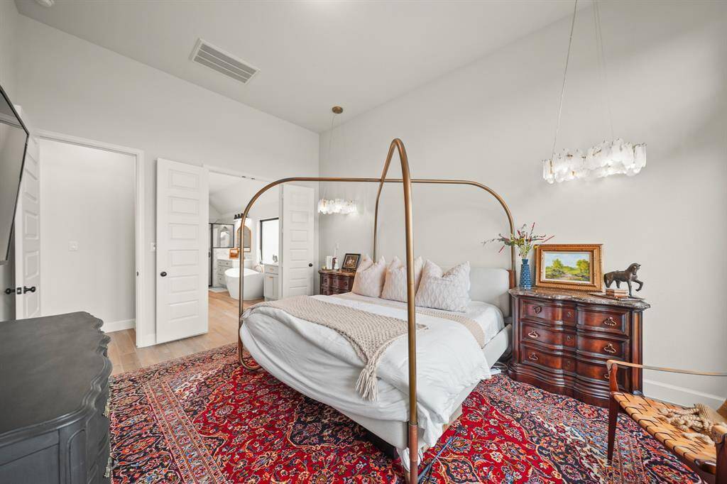 Unwind in the spacious Primary Bedroom, designed with comfort and style in mind for the perfect end to any day.