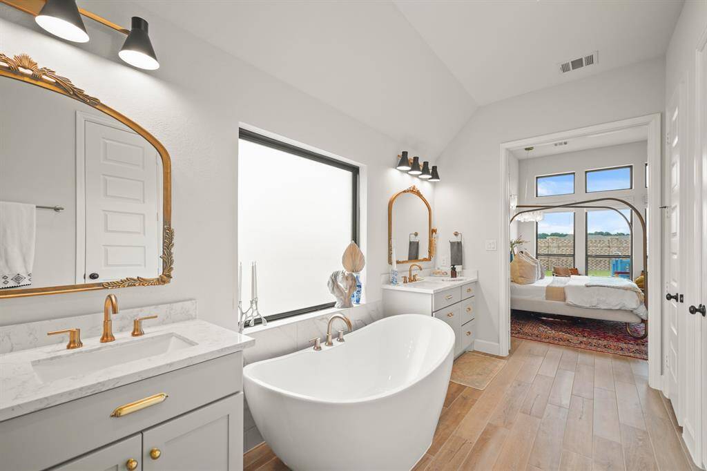 Primary Bathroom features dual sinks, offering both convenience & style. The Primary Closet includes an additional rod & shelf for enhanced storage.